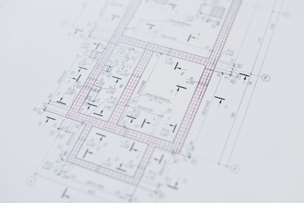 Technical drawings and engineering documents on workspace
